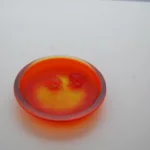 René Lalique — An exclusive and rare orange ‘Deux Zephyrs’ by Lalique — detail 2